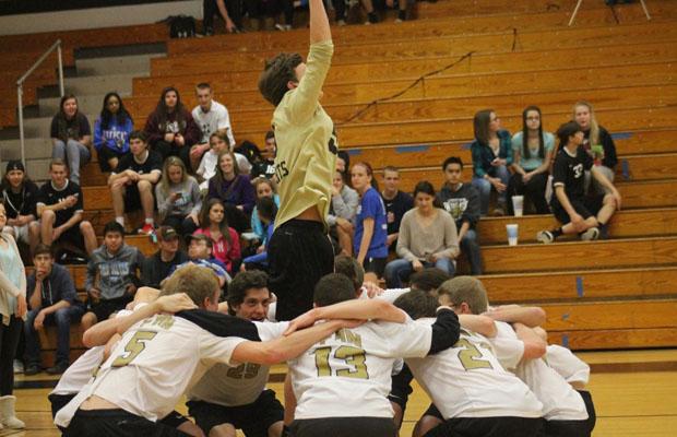 Junior Jake Oppenborn pumps up the boys volleyball team before a game. 