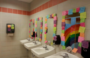 Students for FHN decorate bathrooms with uplifting sticky notes.