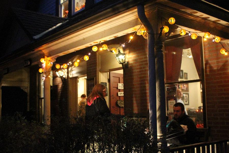 A family relaxes on the porch of the Tintypery. The Tintypery took 5 x 7 photos of individuals, if they were wearing a costume, for five dollars. The Tintypery specializes in old time photography, and provides authentic costumes and props from the 1860’s through the 1920’s.