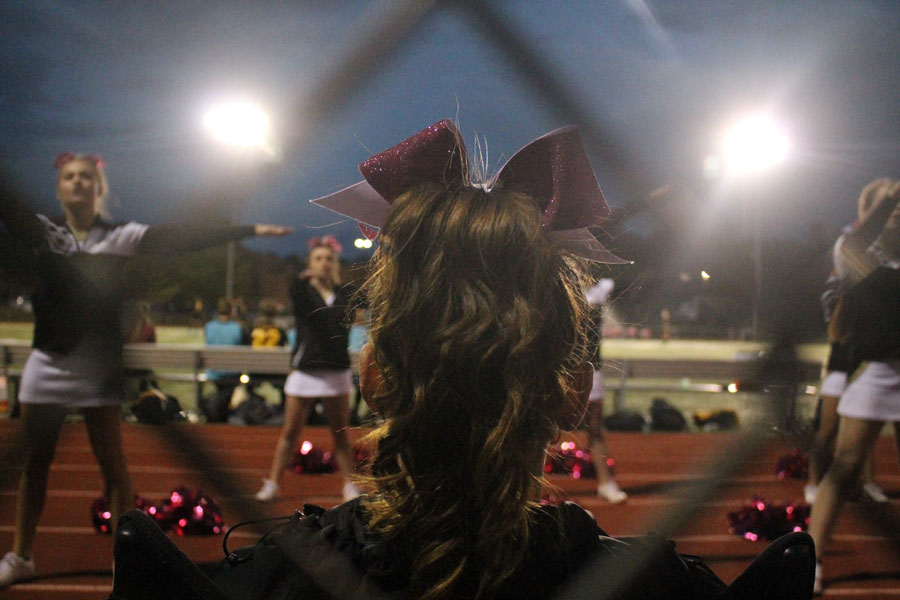  Rehling supports her team on the sidelines while they cheer during a soccer. Due to an injury to her ankle, Rehling has to sit out most of the game. Rehling is only a loud to cheer for a few moment at each game so she does not further injure her ankle.