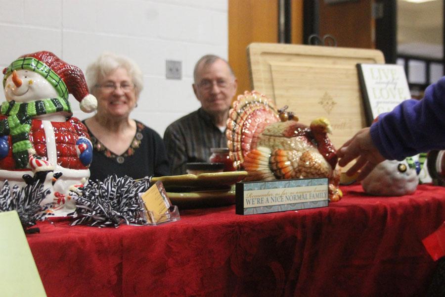 Vendors at last years craft fair sit and talk with shoppers about their merchandise.