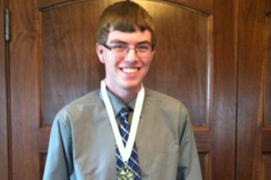 Nathan Rhomberg at the 2014 luncheon wearing his medal after the ceremony. (Photo by Chelsie Hollis)