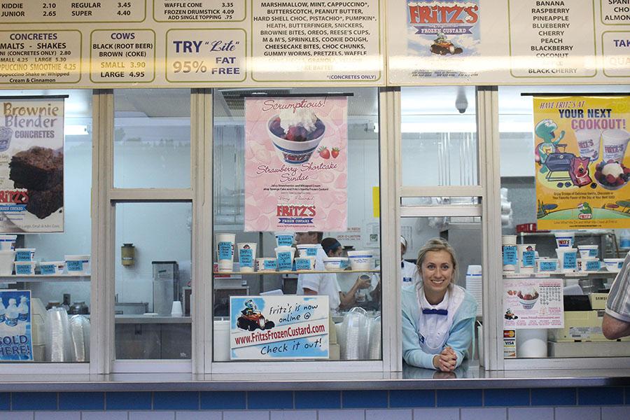 Dagenais looks through the window that she takes orders at. Dagenais does many different jobs in addition to taking people's orders. 
