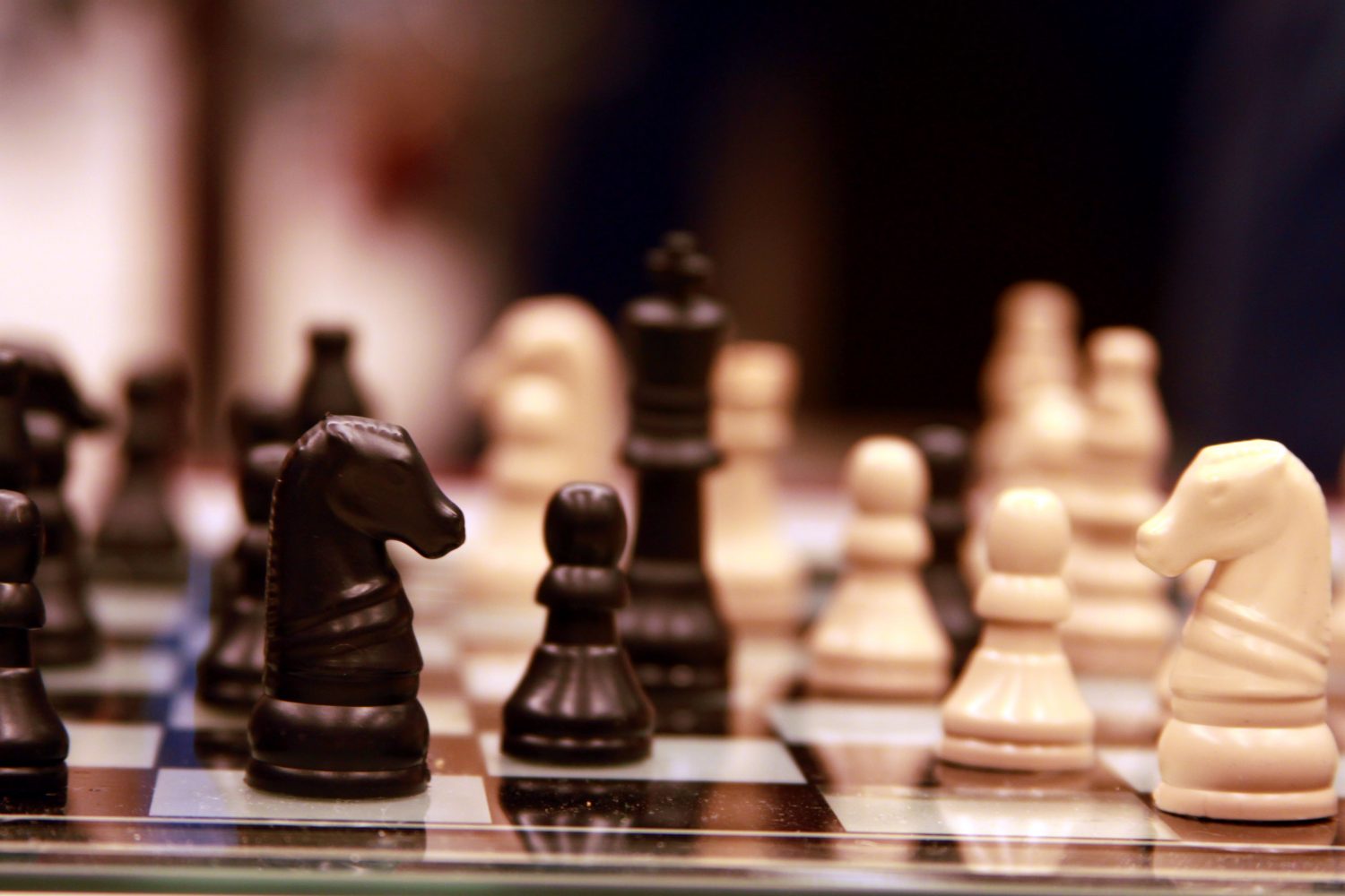 Chess pieces sit on the board before a game. Chess is a strategy-based game involving 16 pieces. “The most difficult thing is thinking ahead several moves and manipulating the board in your favor,” sophomore Madeline DeGraw said. (Photo by Matthew Jewson)