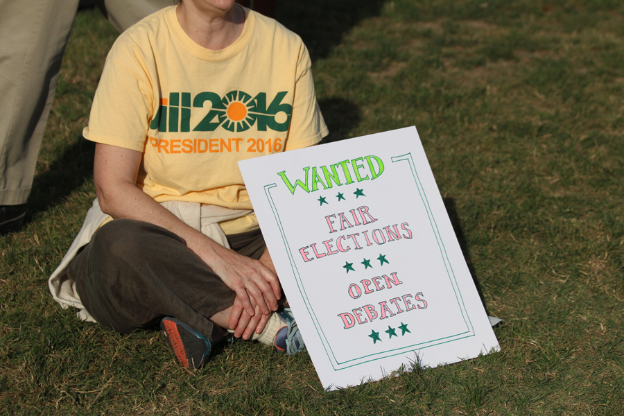 A protester holds a sign in support of Jill Stein before the presidential debate at Washington University on Oct. 9. Many protesters attended in support of opening the debate to the third party candidates. (Photo by Alex Rowe)