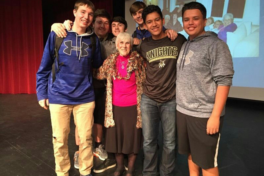 Students stand with Holocaust survivor Rachel Miller after her presentation in 2016. She will speak to sophomore English classes again on Nov. 28. (photo submitted)