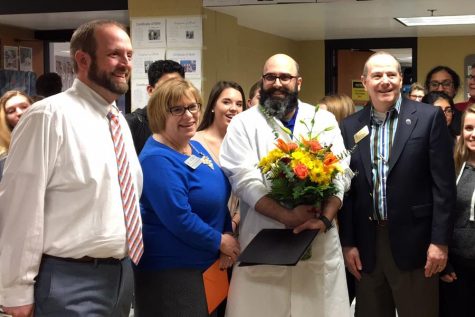 Matthew Riffee stands with FHN principal Andy Downs, Superintendent Mary Hendricks-Harris and FHSD CFO Kevin Supple. Riffee was awarded the title during his fifth hour class on March 1, 2017.