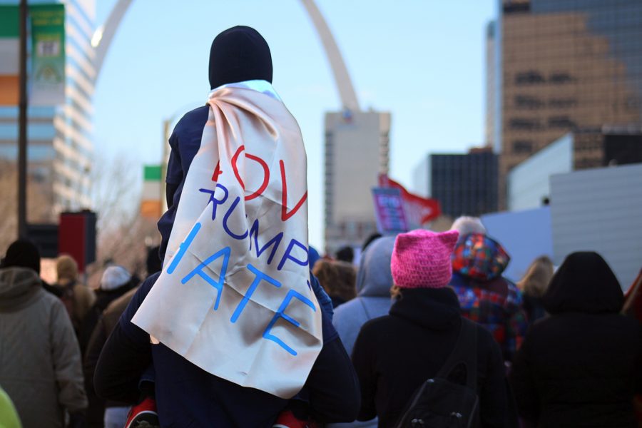 A small boy rides on his father's shoulders as they march in downtown St. Louis, Missouri with other protestors. People of all different ages and backgrounds walked together to show support for the LGBTQ+ community. Many demonstrators marched in protest of the recently passed "bathroom bill", which prohibits transgender students from using the bathroom that matches their gender identity.