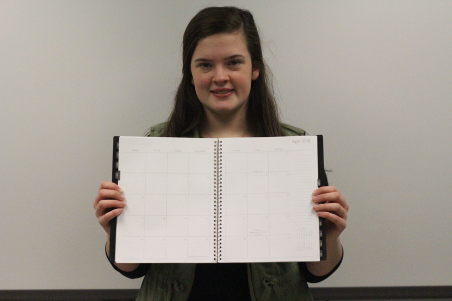 Senior Laraya Griffith poses with a calendar. (Photo by Alex Rowe)