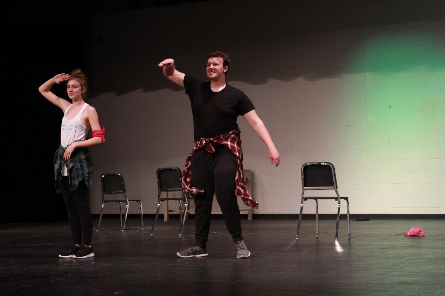 Sophomore Elise Gordon and Junior Christian Witte dance to their dance routine on stage in the auditorium. Witte, also known as Mr. Dancing Queen for Mr. FHN, displayed his talent of dancing alongside four girls to the song Salute by Little Mix. The dancers outfits consisted of black clothing, bandanas and flannels, along with props that were signs that showed women empowerment through words like “equality,” “determination,” “slay,” “feminism” and “strong.”