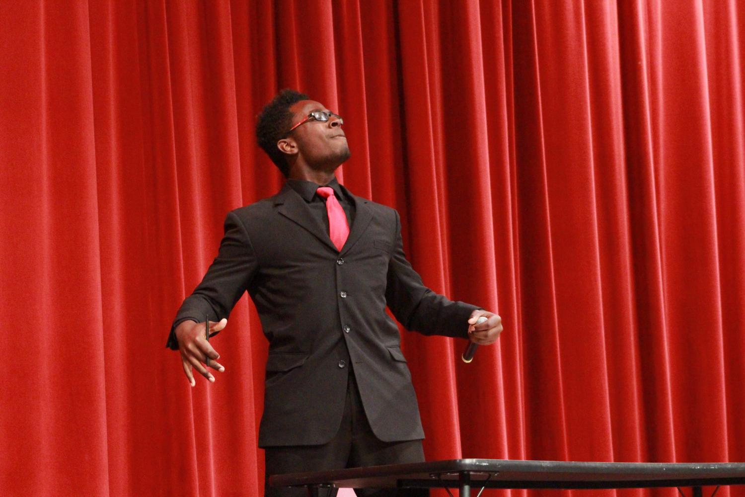 Senior Bryce Perry stands up during his comedy act. His act included writing a letter that included jokes. Mr. FHN included many hilarious moments through jokes, dances and slideshows. Make sure to watch Mr. FHN next year in the auditorium. 