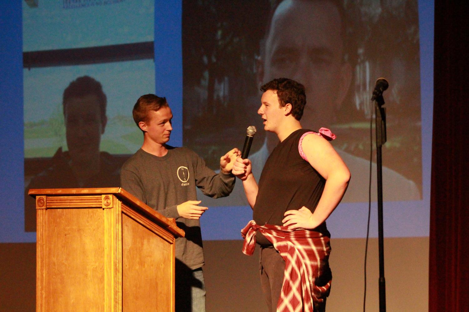 Senior Anthony Kristensen  and Junior Christian Witte talk on stage during Kristensen's slideshow performance. His slideshow started off with many “teacher lookalikes” around FHN, comparing them to actors and even movie characters. He then moved onto comparing the other Mr. FHN contestants and even himself to other people. 