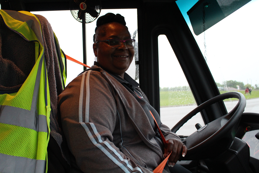 Robin Hamlin sits behind the wheel of D4 outside FHN after dropping off the students she transports to and from FHN.