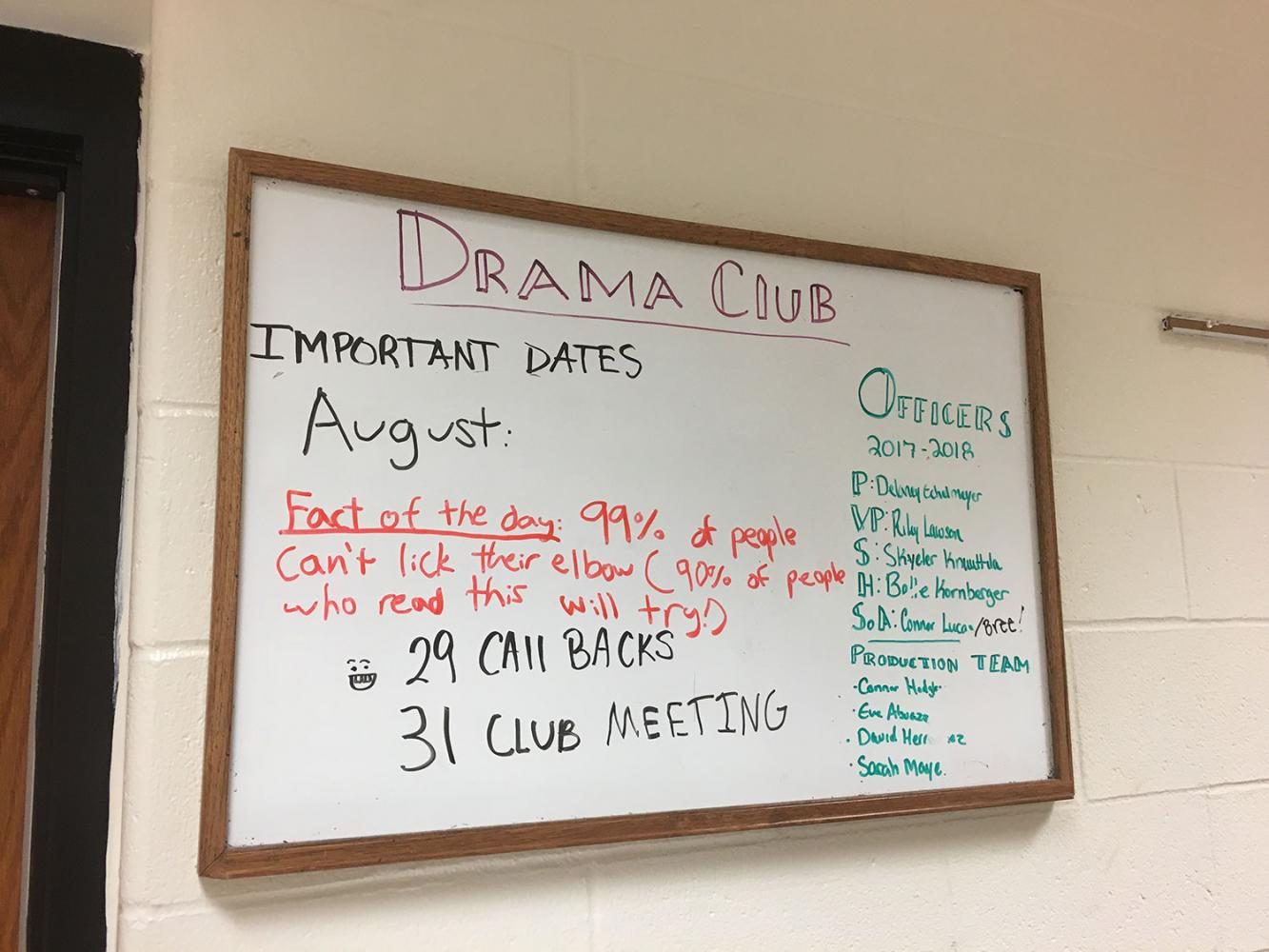 Drama Club President Delaney Echelmeyer, finishes the Drama Club announcement board with new announcements for the day.