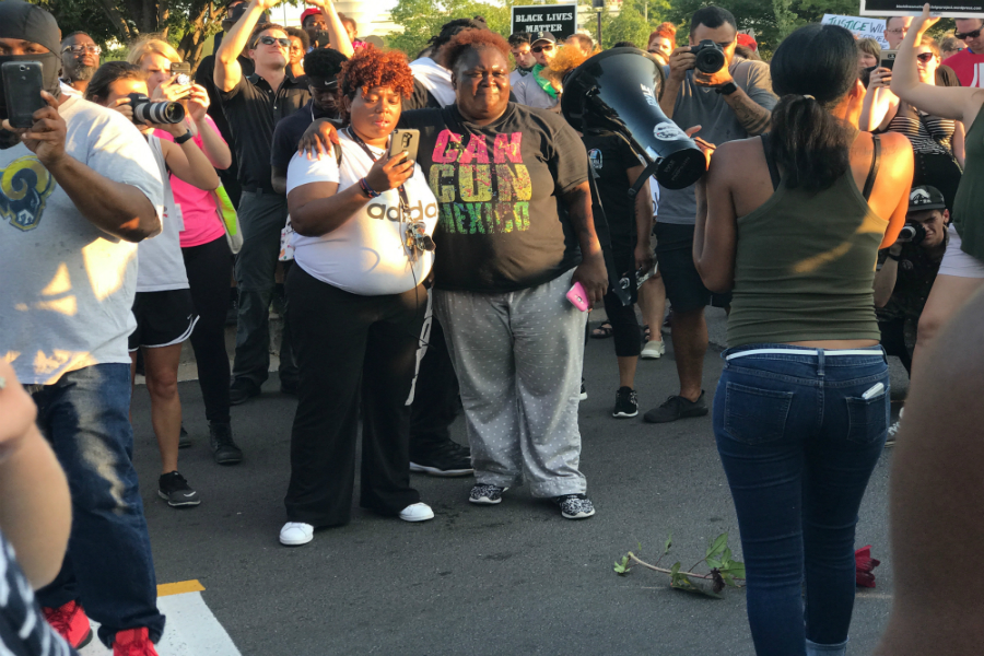 Protesters follow their leaders chants on Sept. 20, at the Galleria Mall.