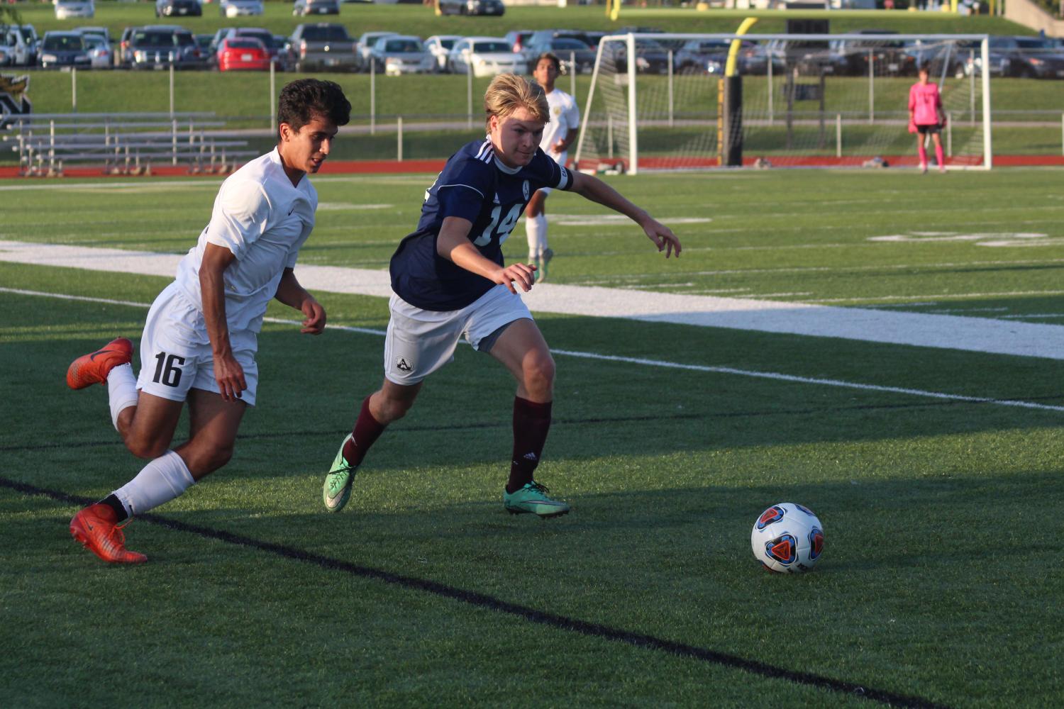 Senior Taylor Elzein runs towards the ball. Boys’ varsity soccer played against the FHC Spartans on Sept. 5. The game tied 1-1 which forced the teams to go into overtime. The Knights won 2-1 due to Joel Arena’s winning shot in penalty kicks. 