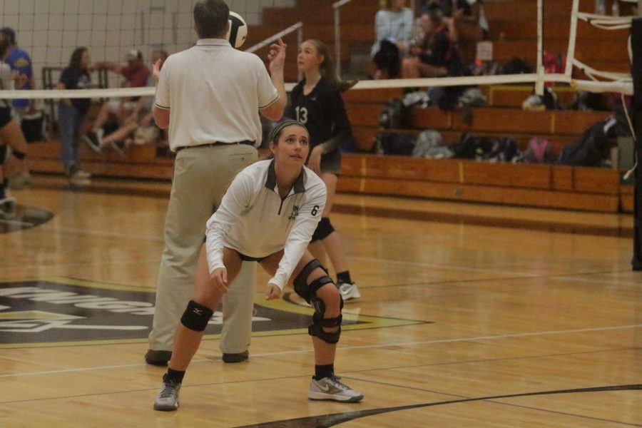 Senior Caty Arnold warms up with the team Thursday, Sept. 7 against Timberland. Due to injury, Arnold has not been able to participate in any games this year. The Knights lost in two sets.
