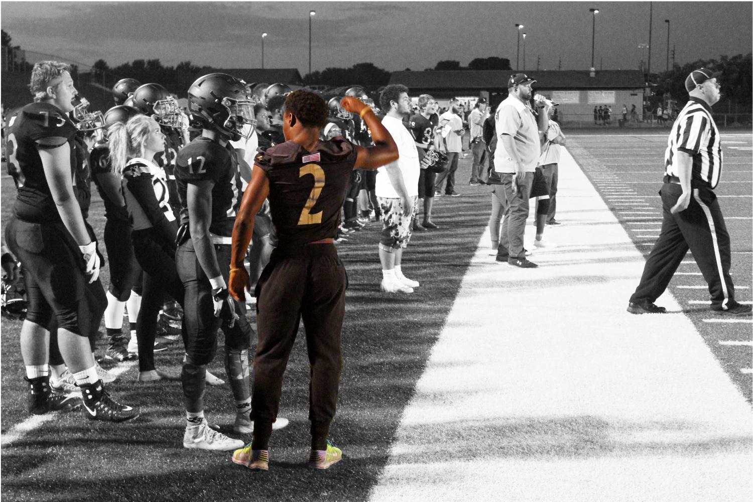 Taron Woods stands on the sideline as he watches the game against Fort Zummwalt West on Sept. 8. The final score was 48-0 FZW (Photo Illustration by Jordan Milewczik and McKayla Bogda) 