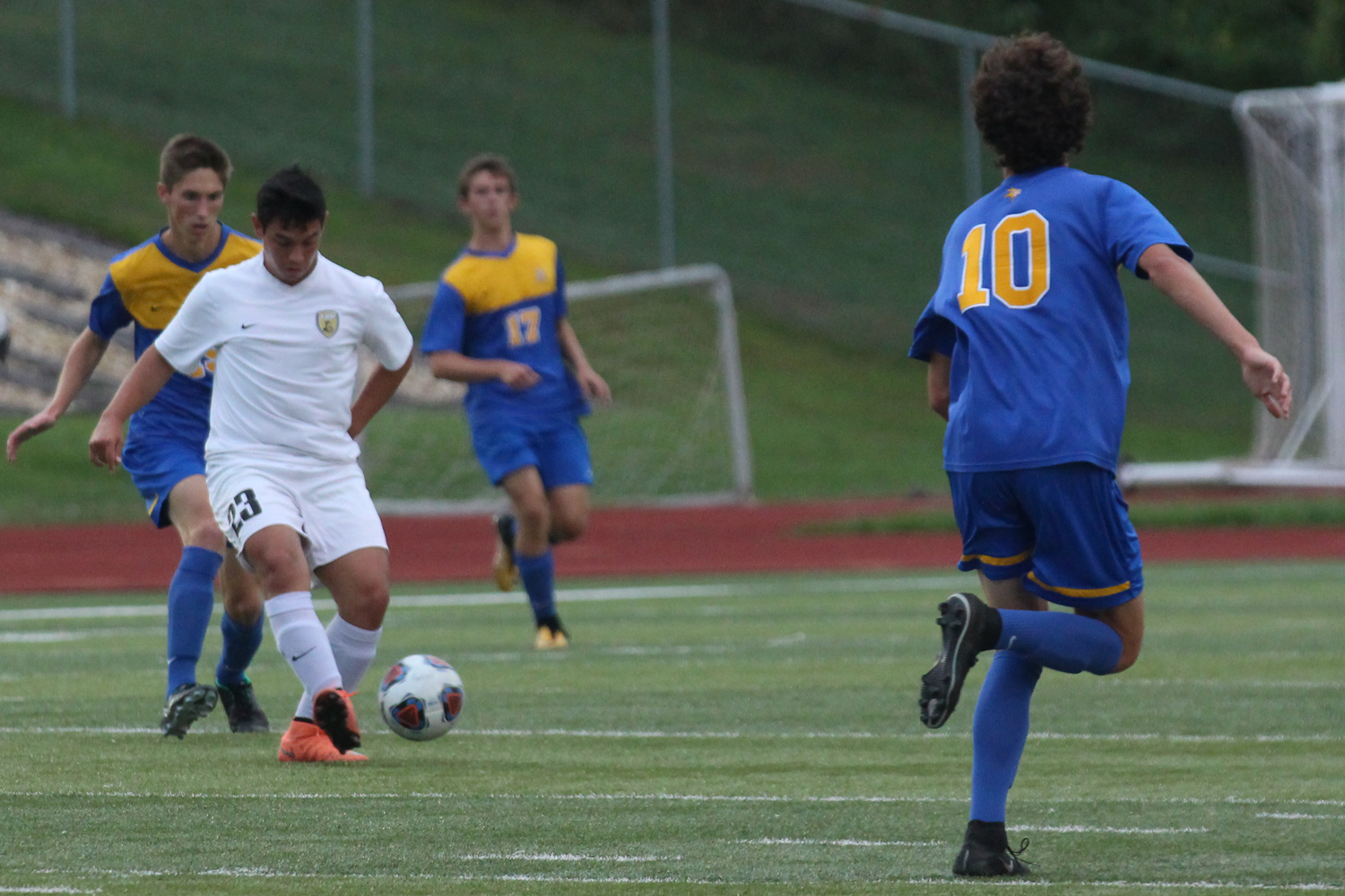 Mateo Morales works to keep the ball away from the Howell defender.