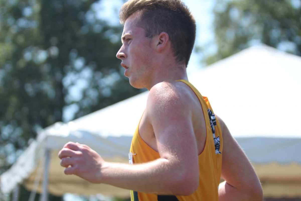 Senior Alex Baker runs in a meet on 9/9 at Forest Park. 