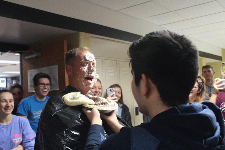 On Oct. 13, social studies teacher Mark Olwig began his birthday with a pie in his face. Olwig had the most money donated in his name during HOSA and DECA's collection competition.