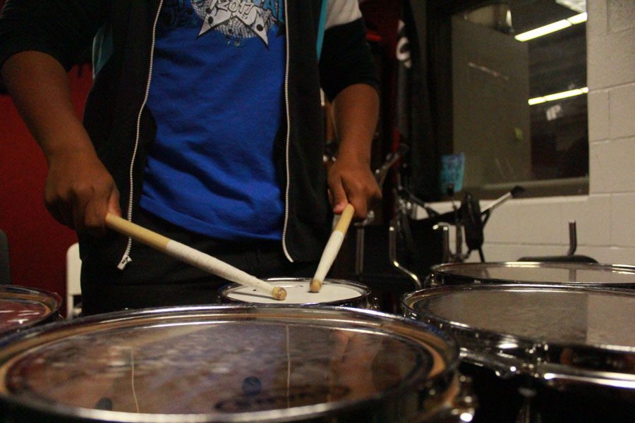 Sophomore Jayden Jaeger practices snare drums in Symphonic band. The class is held in the band room during fifth hour. Symphonic band and choir have worked to get their performance together in time for the Veterans Day assembly on Nov. 10.