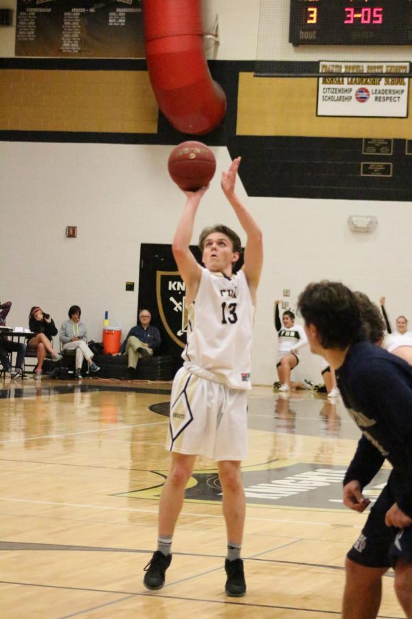 Senior Drew Kilmer shoots a free throw against FHC. The game was Jan. 31.