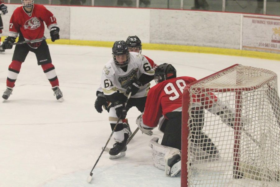 Freshman Kyle Vossmeyer attempts to skate around Fort Zumwalt West's goaltender on 11/10. 