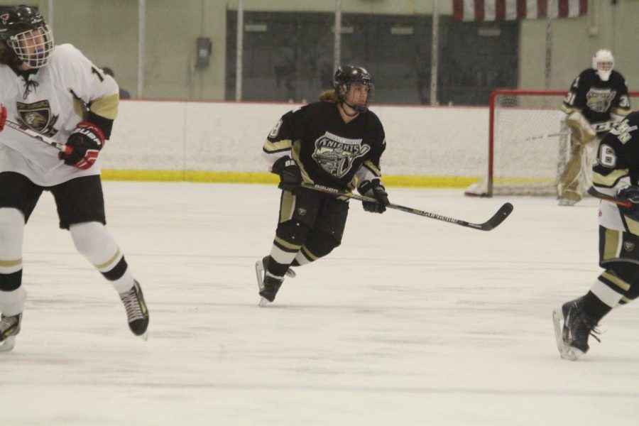 Senior Bryce Longmore skates during a game against FZE. The game was played on Jan. 9.