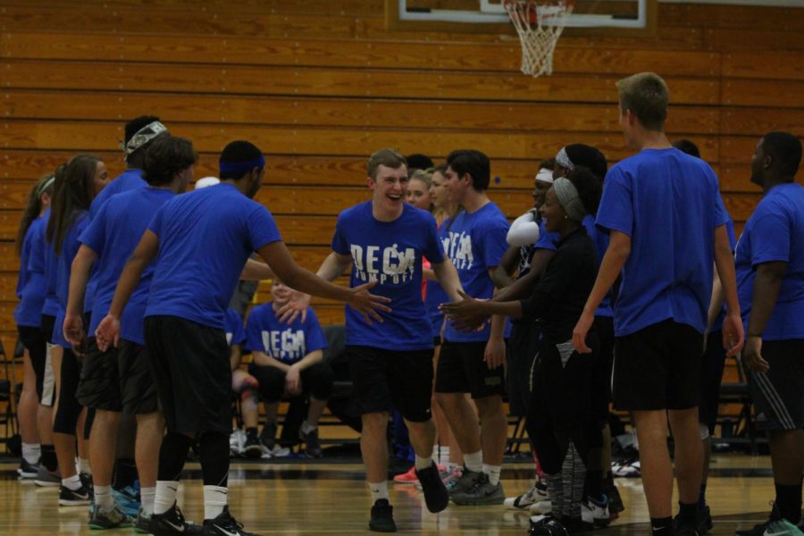 The class of 2017 seniors get pumped up before their 2016 DECA Jump off game against the staff.