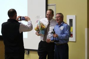 Maintenance man Stan Robertson with FHN Principal Andrew Downs after Robertson was awarded the third annual Support Staff of the Year award