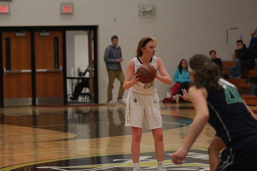 Freshman Isabelle Delarue dribbles up the court during a game against Timberland. 