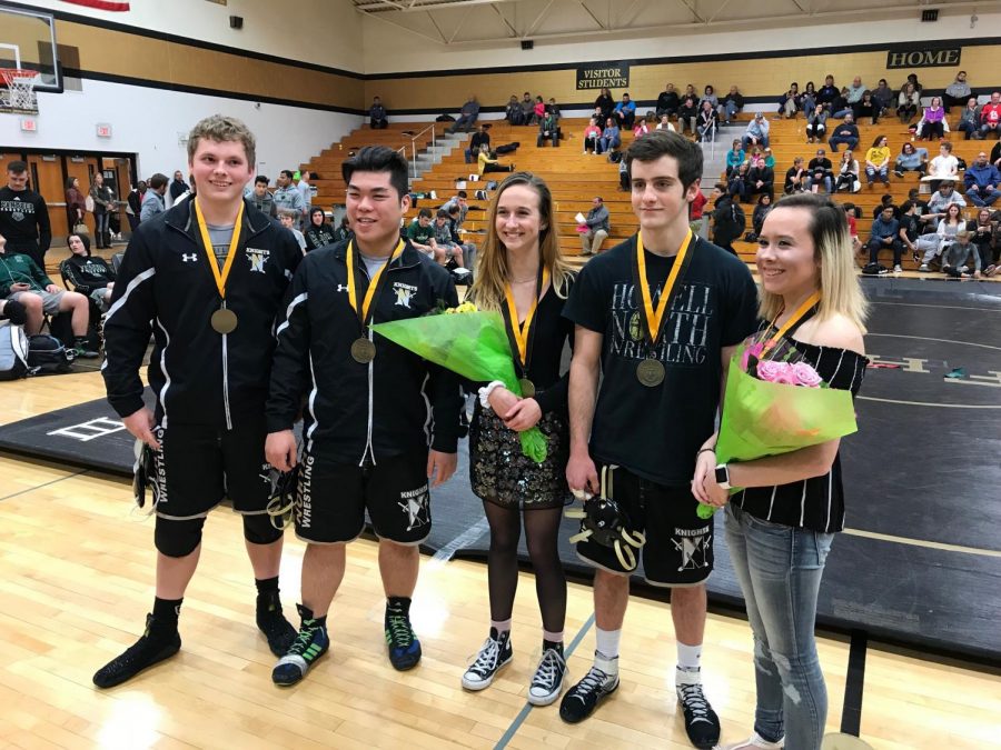 The seniors on the varsity wrestling team pose for a picture in the Francis Howell North gym on January 30, 2018.