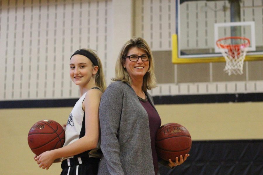 Coach Dawn Hahn poses with her daughter Cate, a player on the team.