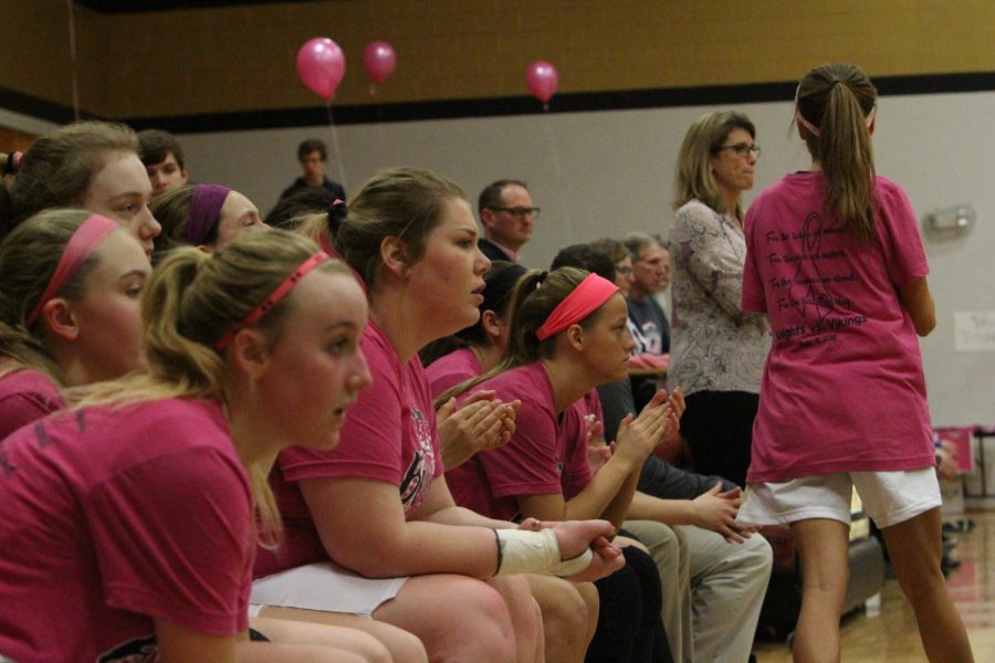 The Lady Knights watching from the bench as their teammates take on Howell