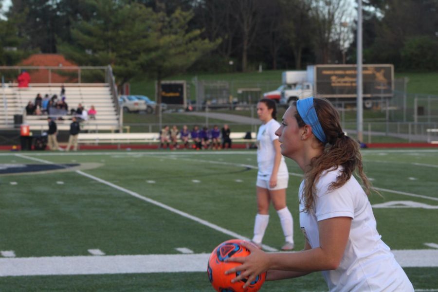 Senior Caty Arnold prepares for a throw-in on 3/30 vs. Troy Buchanan.