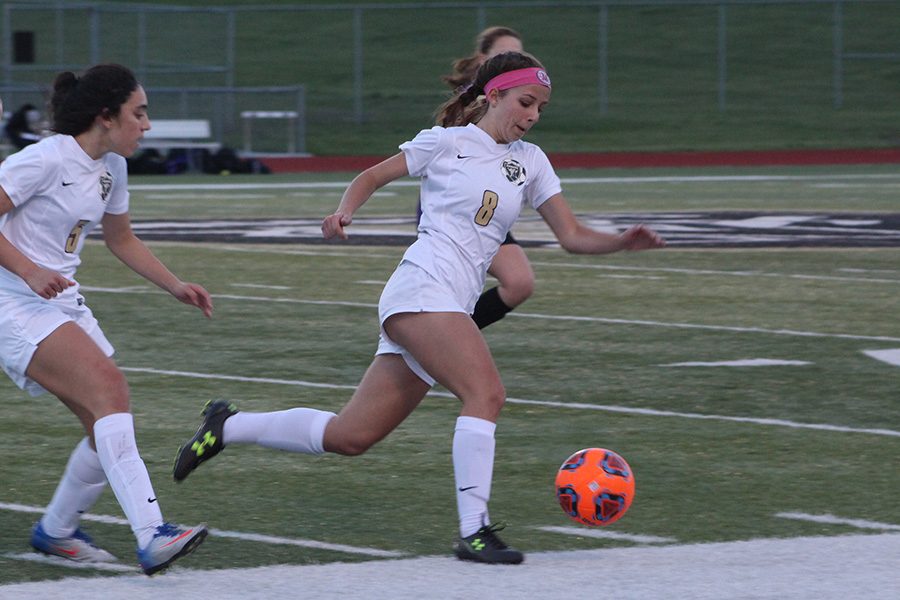 Senior Maddy Wood takes possession of the ball against Troy Buchanan. 