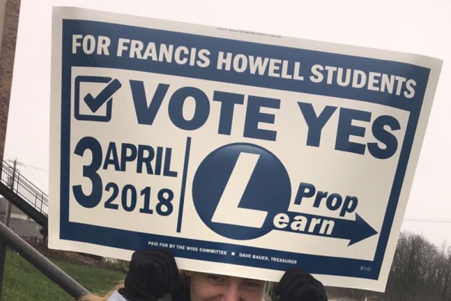 Senor Amber Pryor holds a Prop Learn sign outside of a polling booth on Apr. 13. The FHN Young Democrats stood outside polling
stations in the FHSD area to convince voters to vote in support of the tax levy. Prop Learn failed by a mere 3%, forcing the Board of Education to start thinking of new ways to save money. (Photo submitted)