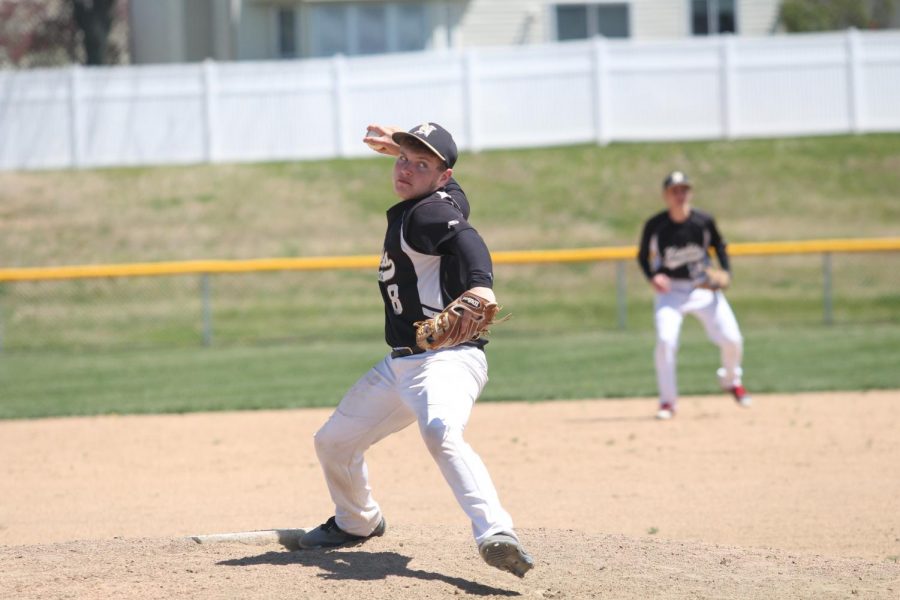 Junior Tyler McLaughlin pitches the ball.