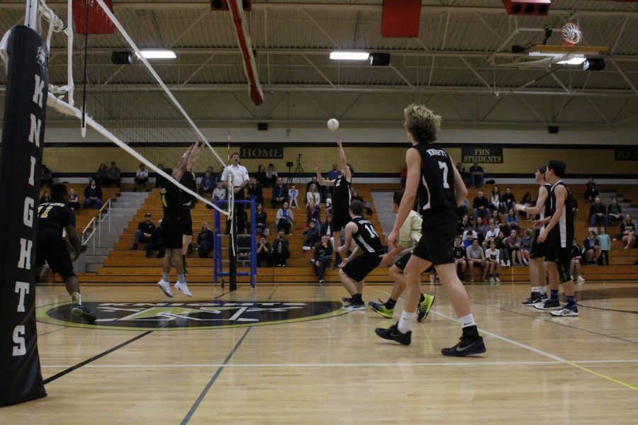 The Knights look to tip the ball over the net in a March 27 match with Fort Zumwalt East.