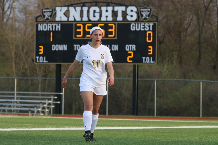 Sophomore Paige Vanek walks away from the scoreboard on 4/17 vs. Troy. 