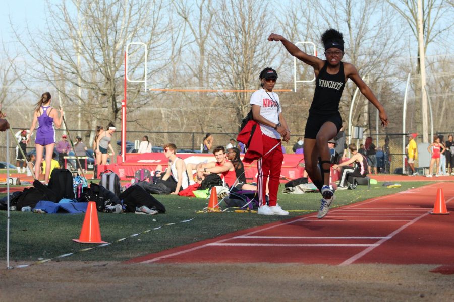 Howell North varsity jumper Marissa Hunt attempts to leave a mark in the sand in a 4/12 meet at PWC.