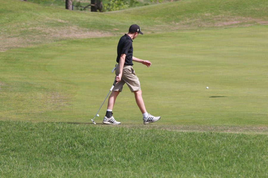 Senior Thomas Bell walks on the green vs Francis Howell.