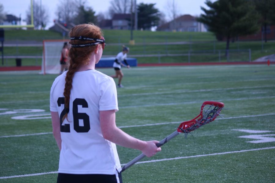 Junior Autumn Schrader prepares to take the field in a game against Incarnate Word Academy.