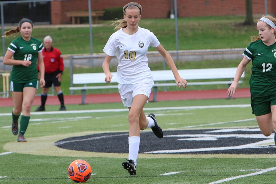 Freshman Alli Vernon takes possession of the ball around the 50 yard line vs. Marquette on 5/3.