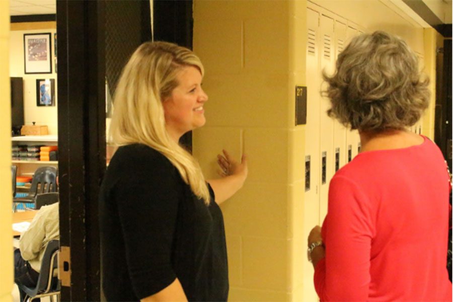 English teacher Jani Wilkens speaks to a parent during Open House. (file photo)