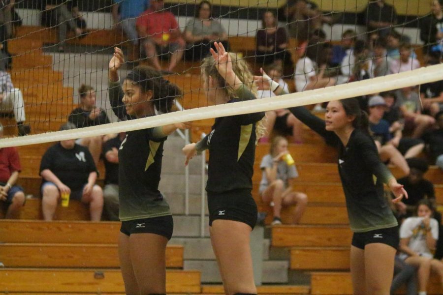 Team captain and senior Payton Stephenson prepares to block a serve during a game against the Lady Indians of Holt on Sept. 11 at FHN. The Lady Knights won the second and last set, winning the match. Stephenson was recently named captain for the 2018 varsity season.