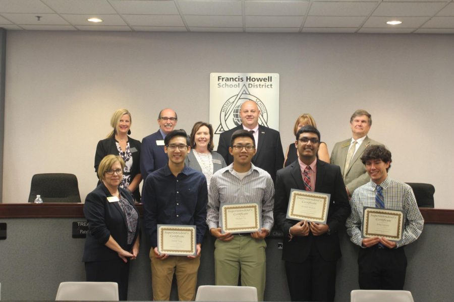 FHSD board members and students stand with their awards as AP Scholars. David Yang, Michael Yu, Rishith Mishra and Riley Lawson all received a superintendent certificate for being AP Scholars in their classes. The board recognizes students in order to achieve an engaging learning environment. 