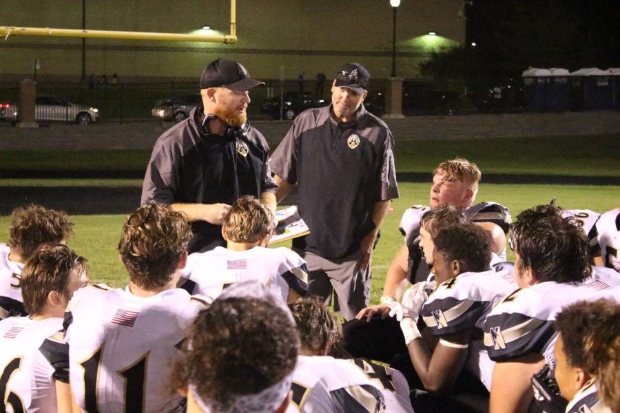 Head coach Brett Bevill talks to the team after their game against Ritneor