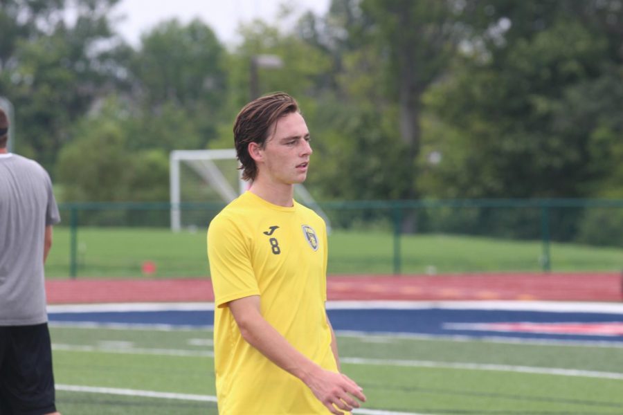 Senior Adam Shine prepares to warm up before a game against Liberty